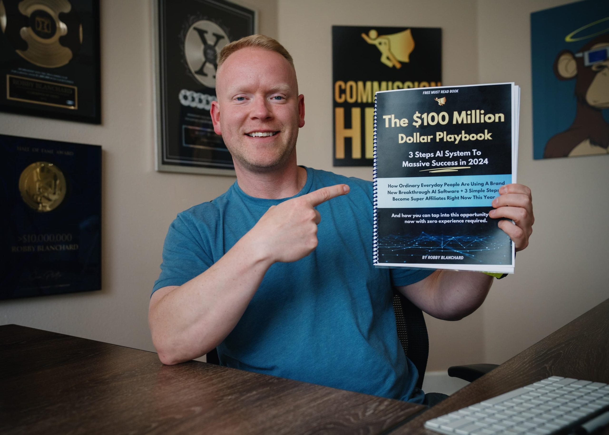 Robby Blanchard holding The $100 Million Dollar Playbook, a free training resource from Commission Hero